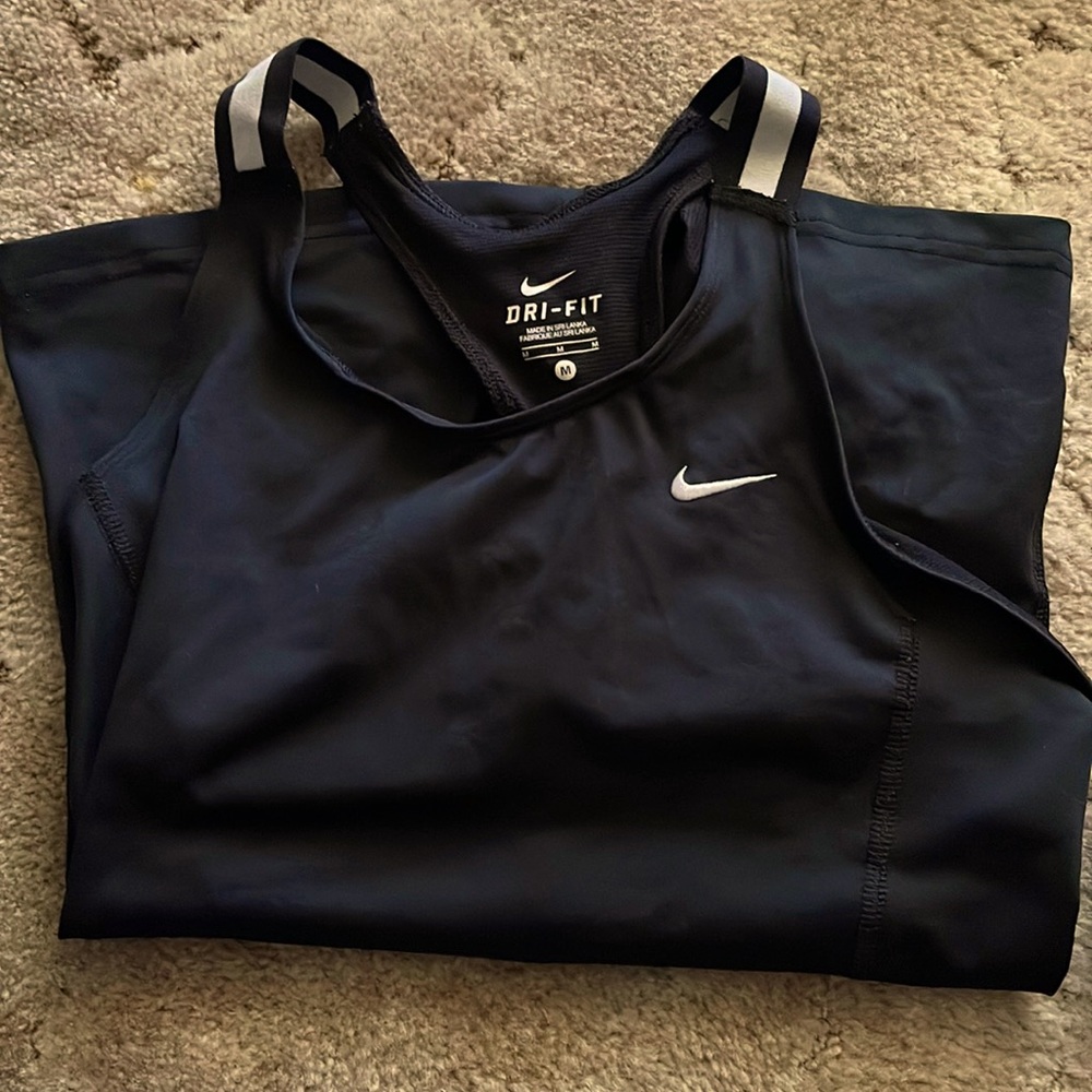 DRI-FIT NIKE tank top. NWOT. Size M. Worn twice. Smoke free home. Built in bra!